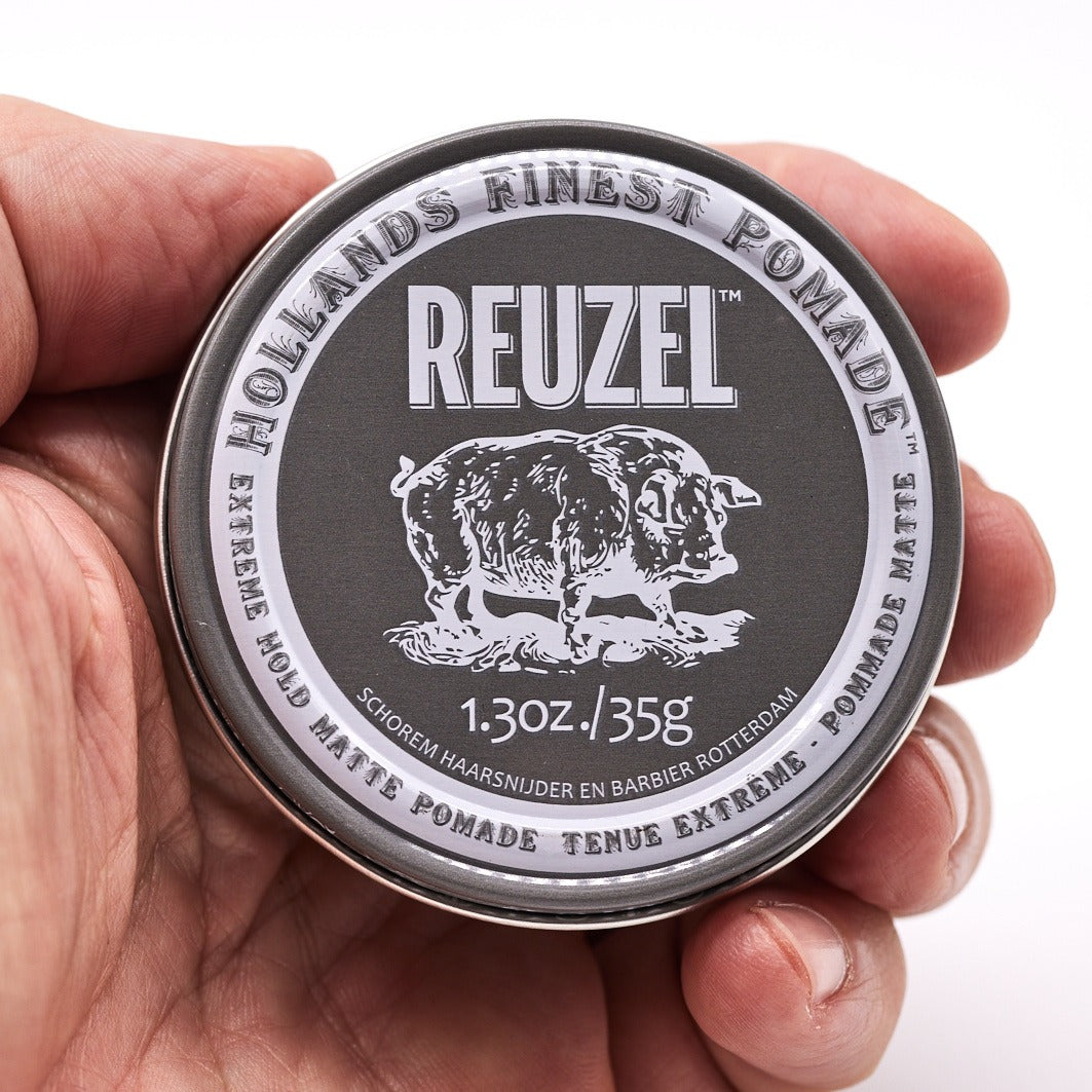 Pro REUZEL 1.3oz Pomade bundle featuring two tins of styling pomade with red and black packaging on a white background.