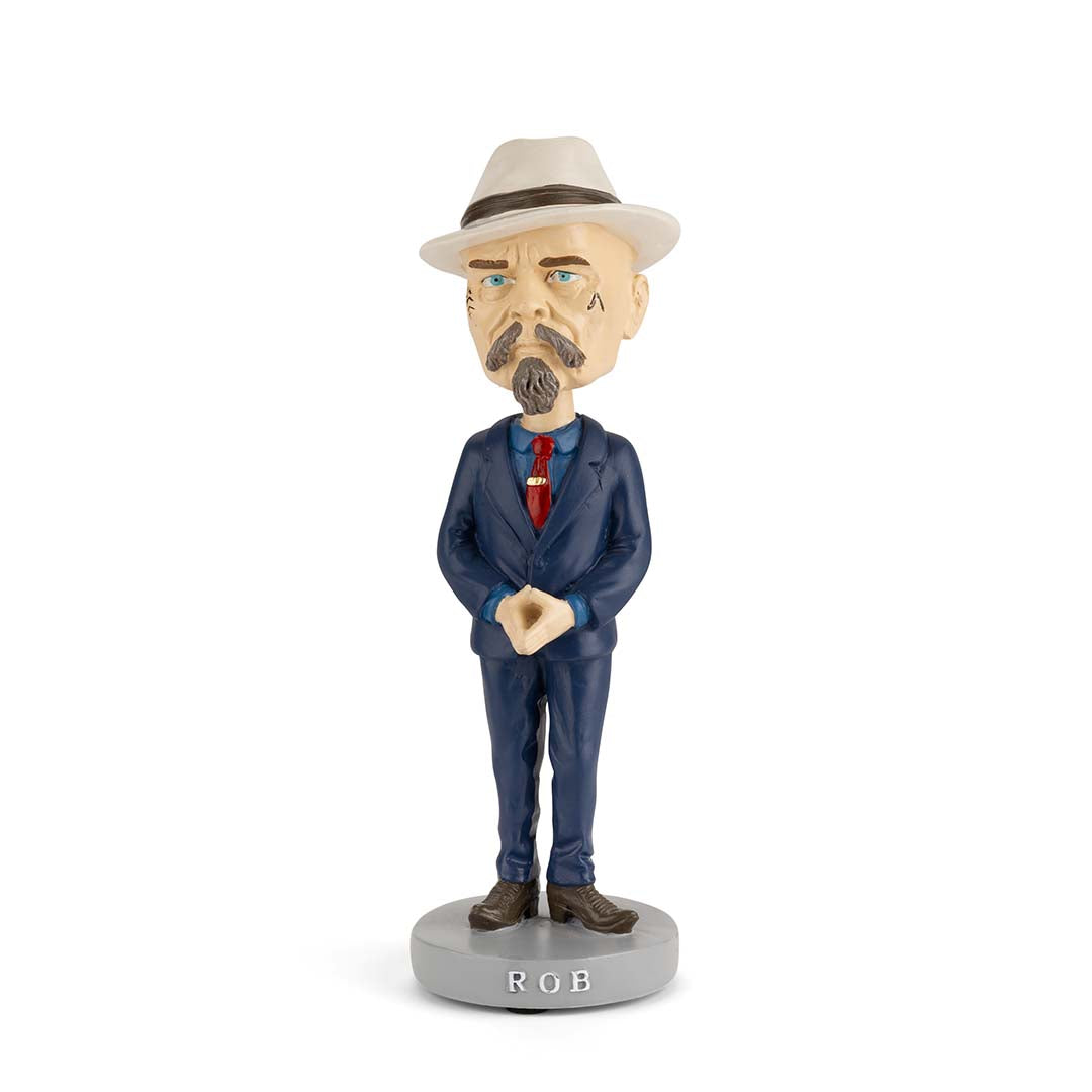 Vendor 2026 barber pole display with bobble head figurines featuring a sleek, modern design and vibrant colors.