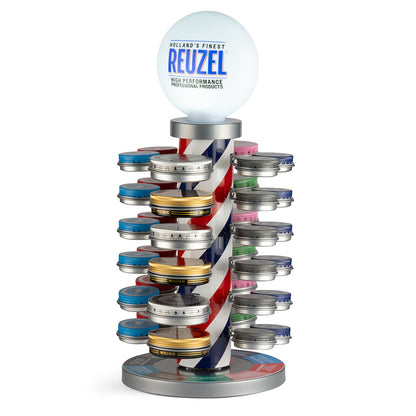 Colorful barber pole display with twisted design and assorted bobble head figures, showcasing a vintage barber shop theme.