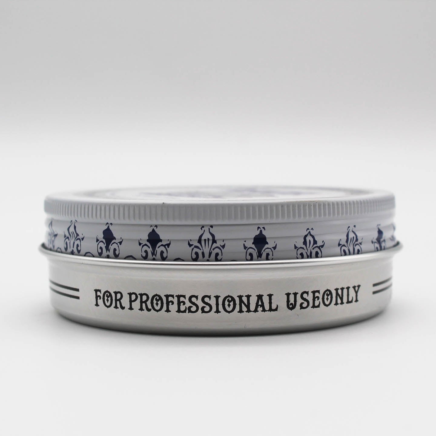 Reuzelinc Clay Matte Pomade jar showing the product's label and textured clay formula for matte hold and style.