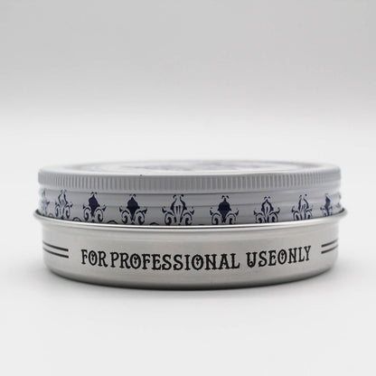 Reuzelinc Clay Matte Pomade jar showing the product's label and textured clay formula for matte hold and style.