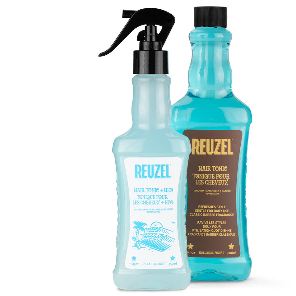 Pro REUZEL Hair Tonic and Reuzel spray bottle, front view showing the product labels and packaging for hair styling.