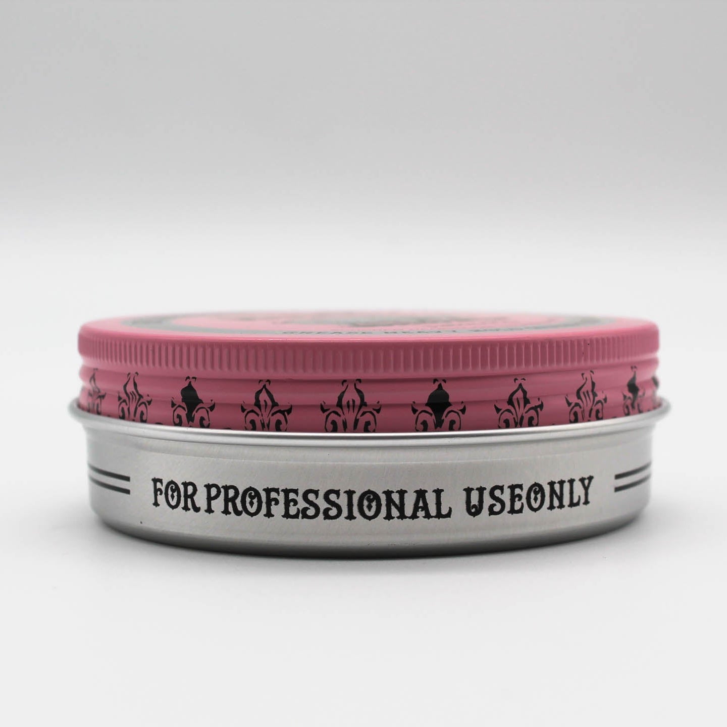 Reuzelinc pink pomade grease jar with a black lid, showing vibrant pink product inside, ideal for styling and shaping hair.