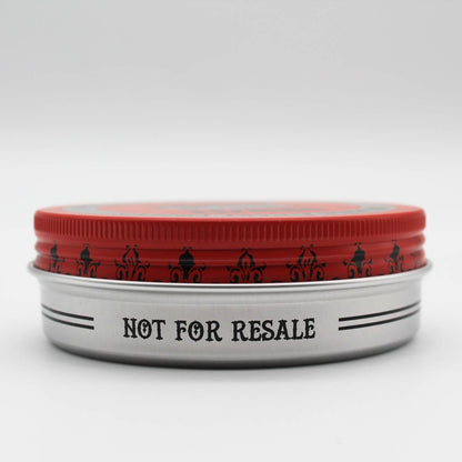 Red Reuzelinc Pomade in a jar, glossy red packaging, ideal for styling and holding hair with a classic pomade texture.