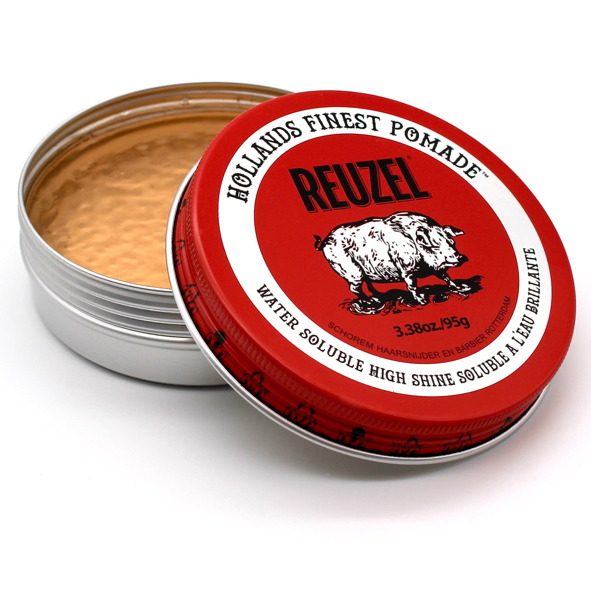 Red water-soluble pomade by Reuzel, showcasing a glossy finish and smooth texture for stylish hair styling.