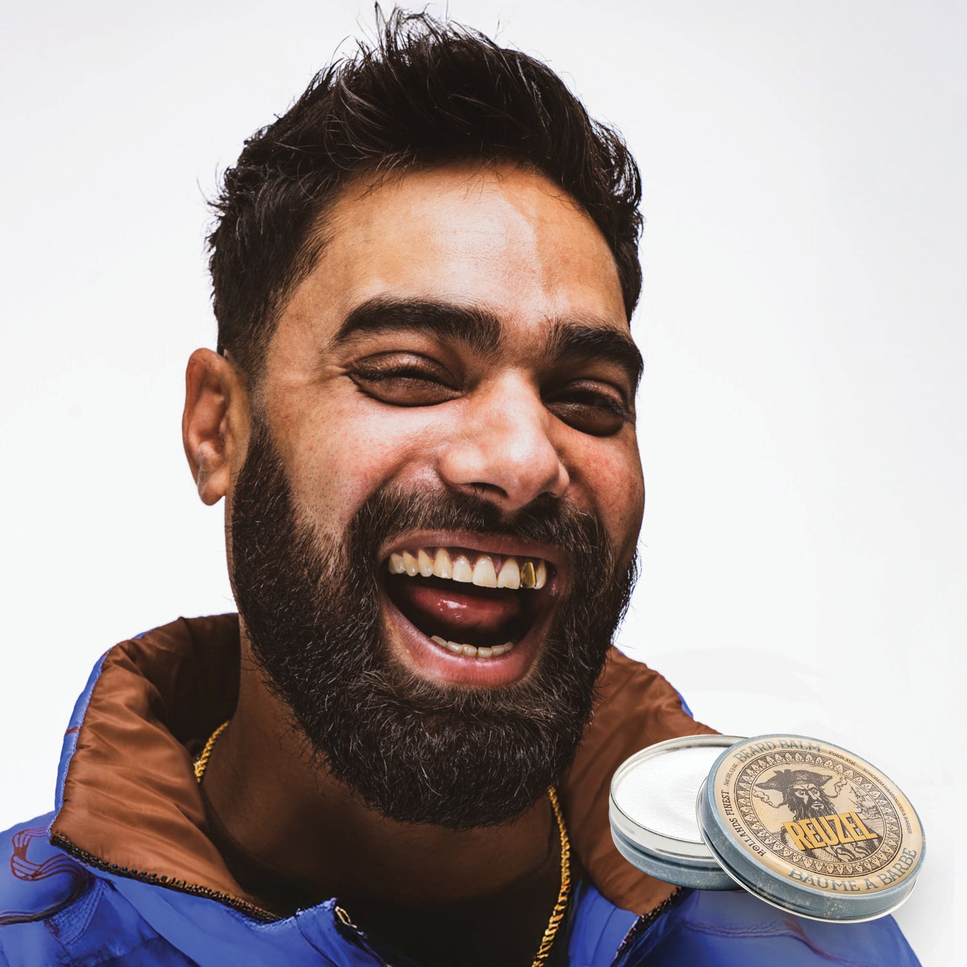 Man with brown hair and beard styled with Wood & Spice Beard Balm REUZEL 