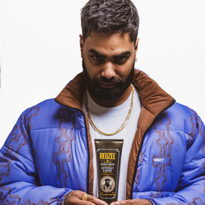 MAN WITH BEARD WASHED WITH REUZEL Beard Wash