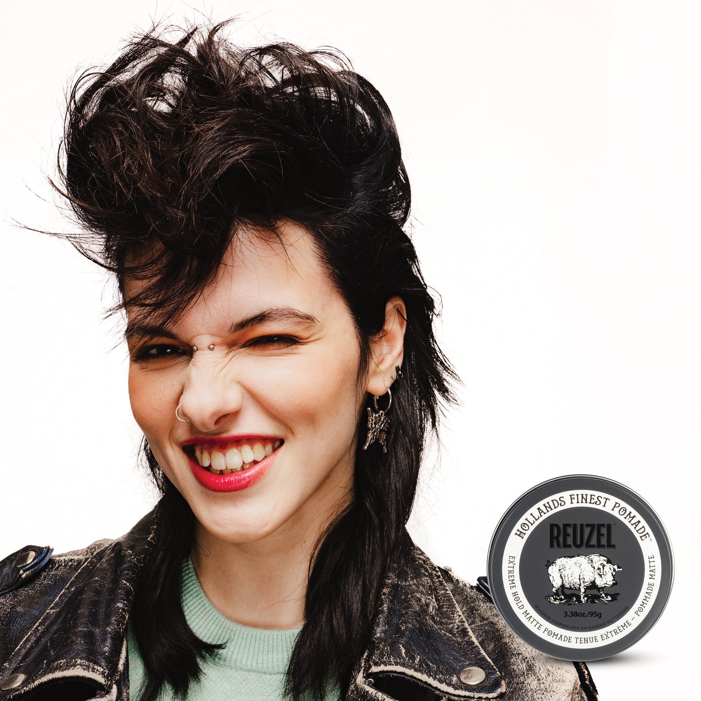 Woman with brown hair styled with Extreme Hold Matte Pomade by REUZEL