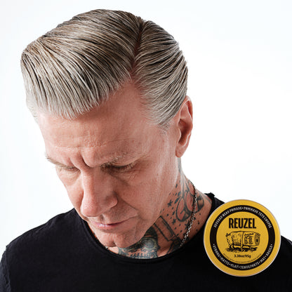 Six Pro REUZEL Severed Head Pomades bottles with two free for backbar, showcasing the product's packaging and branding.