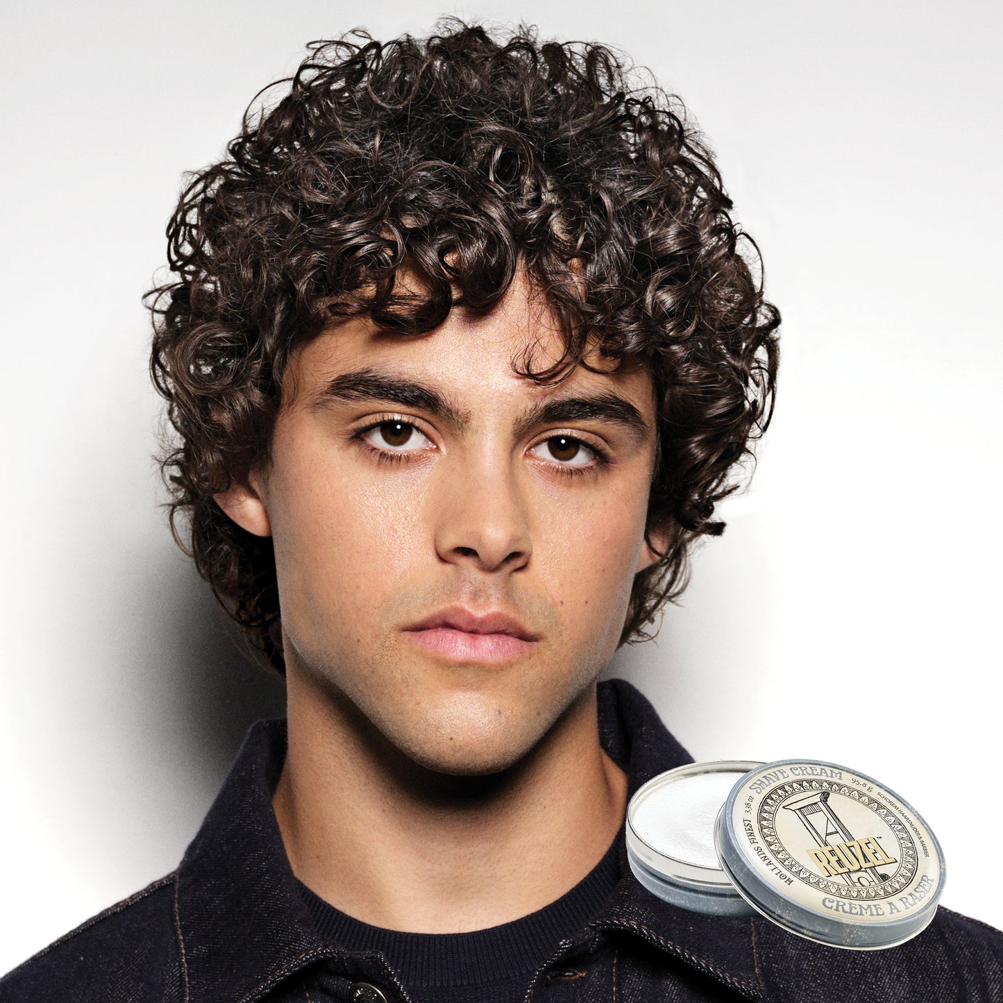 MAN WITH Cleanly shaved face using REUZEL Shave Cream