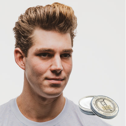 MAN WITH Cleanly shaved face using REUZEL Shave Cream
