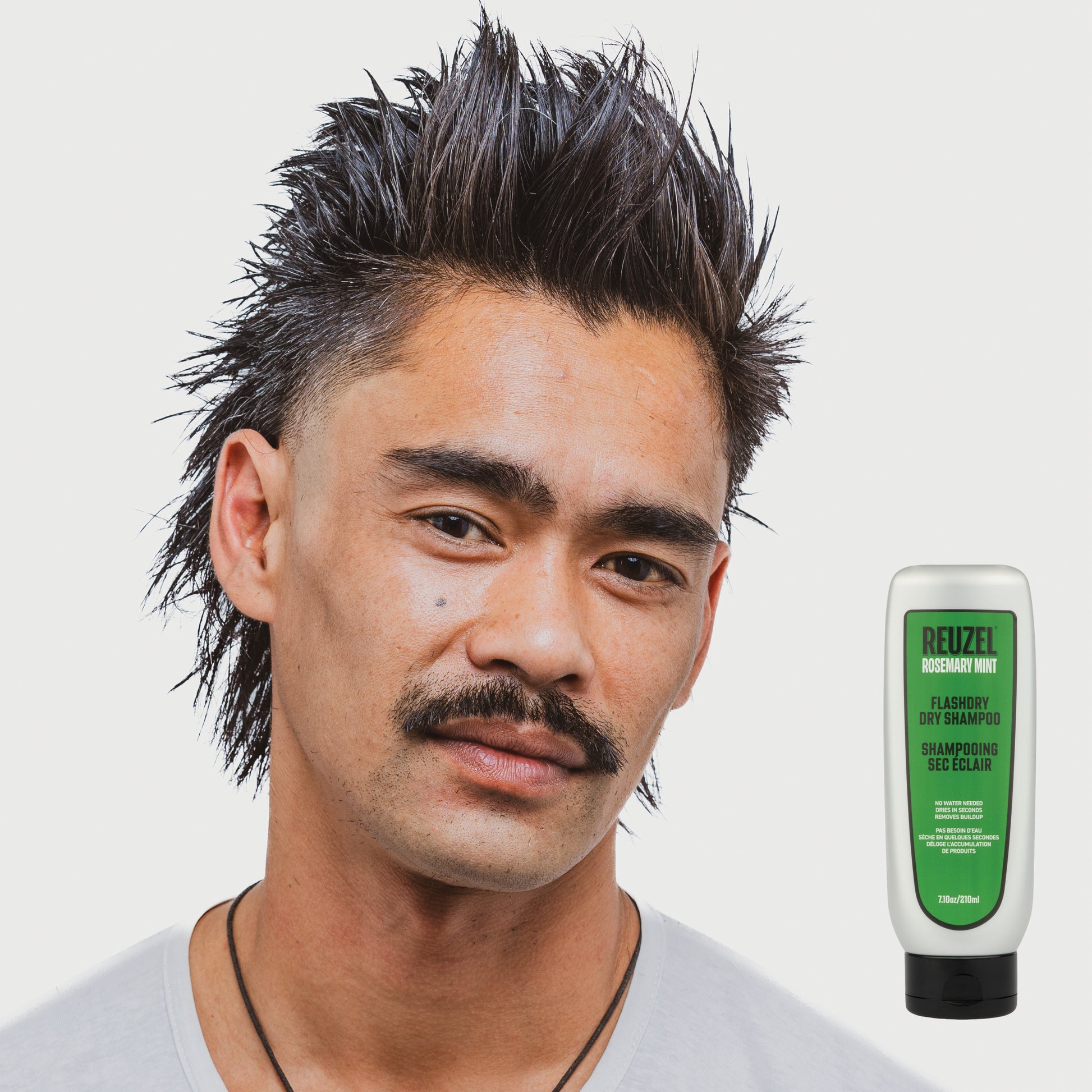 Vendor FLASHDRY dry shampoo bottle with spray nozzle, featuring sleek packaging and branding on a clean background.