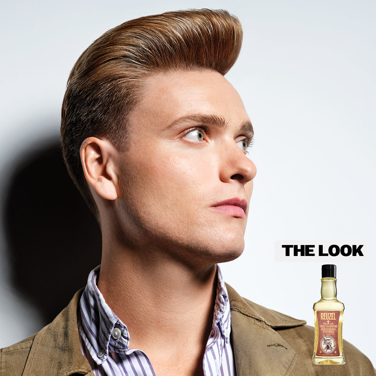 Man with styled hair and a bottle of Daily Shampoo with 'The Look' text.