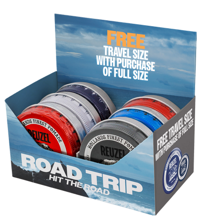 Display of Vendor Road Trip Pomade packaging with multiple boxes, showcasing the product's branding and design.